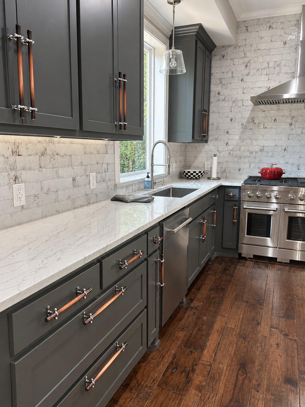 Tim - Ft. Worth, TX - Charcoal shaker cabinets with matching copper cabinet pulls throughout the kitchen, paired with white countertops and stainless steel appliances. — solid copper cabinet hardware handmade in Tennessee